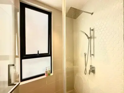 a bathroom with a shower and a window at 7Pax Muji Continew KL Centre View 10mins to TRX KLCC IKEA in Kuala Lumpur