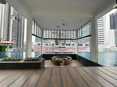 a large building with a view of the water at Skyline Homes by Reizz in Kuala Lumpur