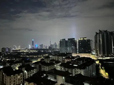 a view of a city at night with tall buildings at Skyline Homes by Reizz in Kuala Lumpur