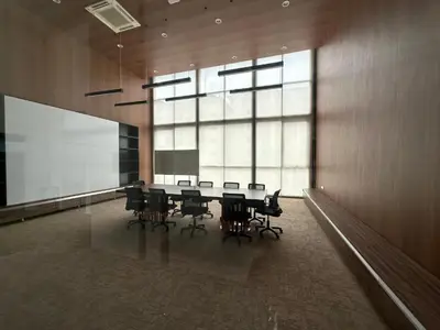 a conference room with a table and chairs and a large window at Skyline Homes by Reizz in Kuala Lumpur