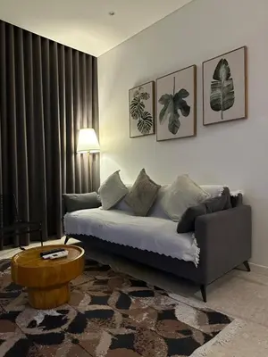 a living room with a couch and a table at Sky Suites KLCC by The Sense in Kuala Lumpur