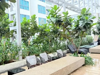 a patio with a table and chairs in a building at Colony Relax Residences Klcc in Kuala Lumpur