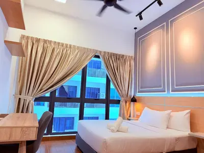 a bedroom with a bed and a large window at Colony Relax Residences Klcc in Kuala Lumpur