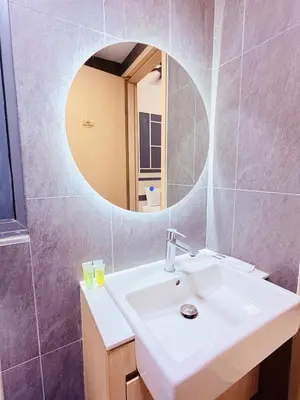a bathroom with a sink and a mirror at Colony Greenfield Suites Klcc in Kuala Lumpur