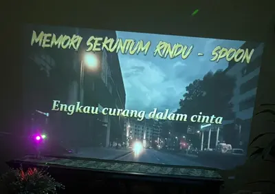 a sign for an event in a city at night at Zetapark condominium in Kuala Lumpur
