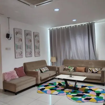 a living room with two couches and a coffee table at Zetapark condominium in Kuala Lumpur