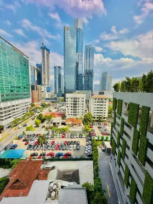 an aerial view of a city with a parking lot at Agile Suites TRX KlCC in Kuala Lumpur