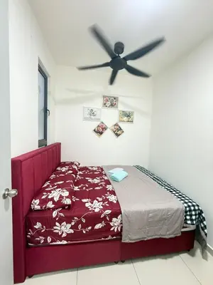 a bedroom with a bed and a ceiling fan at Cozy Kenwingston Setapak 3BR & 2BR 5-8 Pax l Parking & Netflix 3201 in Kuala Lumpur