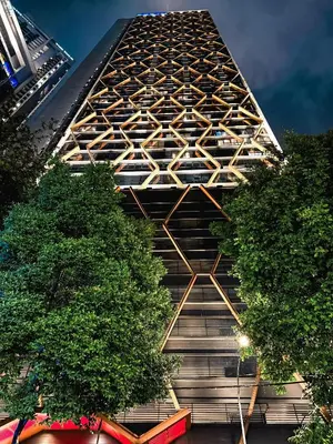 a tall building with trees in front of it at Skyline Homes by Myfly247 in Kuala Lumpur
