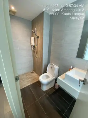 a bathroom with a toilet and a sink at NiceStay in Kuala Lumpur