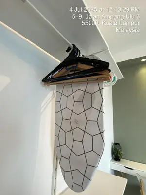a towel rack hanging from the ceiling of a room at NiceStay in Kuala Lumpur