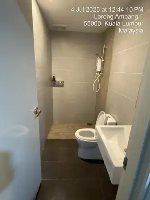 a bathroom with a toilet and a sink at NiceStay in Kuala Lumpur