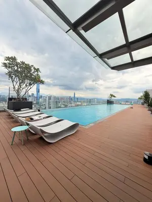 a row of boats sitting on the roof of a building at COzy Suite KL Sentral By Riveria City in Kuala Lumpur