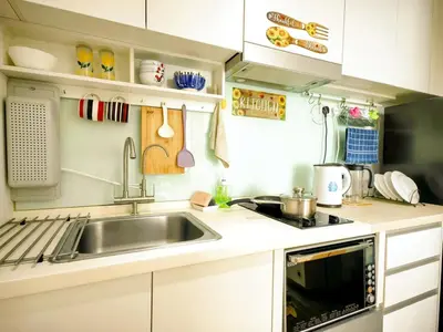 a small kitchen with a sink and a stove at Setapak Central KL - Zetapark Summer Suites in Kuala Lumpur