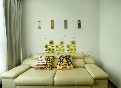 a living room with a couch with pillows on it at Setapak Central KL - Zetapark Summer Suites in Kuala Lumpur