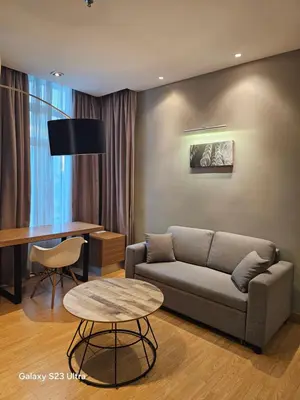 a living room with a couch and a table at Executive Suite Dua Sentral in Kuala Lumpur