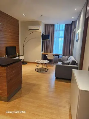 a living room with a couch and a table at Executive Suite Dua Sentral in Kuala Lumpur