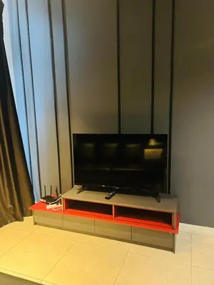 a flat screen tv sitting on top of a table at Axon Residence Bukit Bintang by Comfort Stay in Kuala Lumpur