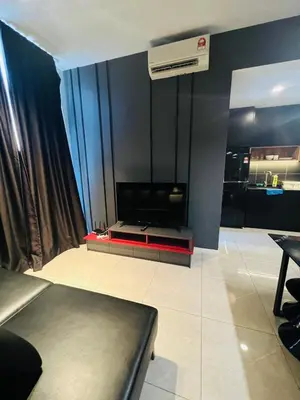 a living room with a flat screen tv on the wall at Axon Residence Bukit Bintang by Comfort Stay in Kuala Lumpur
