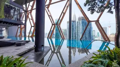 a swimming pool with a view of the city at Scarletz Suite KLCC by Light House 1 in Kuala Lumpur