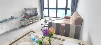 a living room with a couch and a table at Agile Service Residence by TRX KLCC in Kuala Lumpur