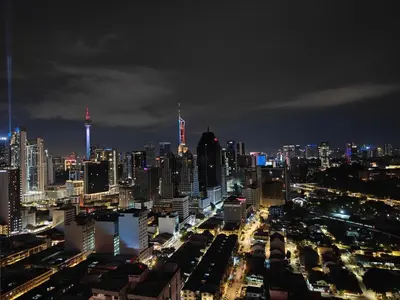 a view of a city at night with at Chambers Vista Suites Urban Haven KLCC in Kuala Lumpur