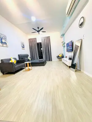 a living room with a couch and a table at Chambers Vista Suites Urban Haven KLCC in Kuala Lumpur