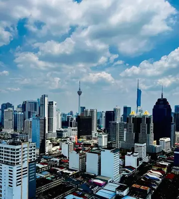 a view of a large city with tall buildings at Chambers Vista Suites Urban Haven KLCC in Kuala Lumpur