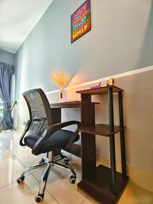 a desk and a chair in a room at Master Room, Razak City Residence in Kuala Lumpur