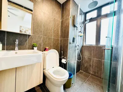a bathroom with a toilet and a sink and a shower at The Luxe & Colony KLCC By LuxeHub in Kuala Lumpur