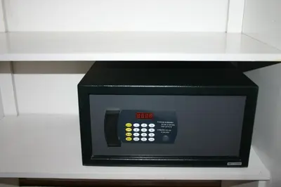 a microwave oven sitting on top of a shelf at Cardogan Hotel in Kuala Lumpur