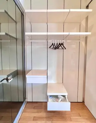 a room with a closet with hangers and lights at The Calma, Platinum Suites 2 BR in Kuala Lumpur