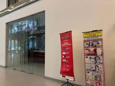 a store front with a red sign on a wall at SkyPool KLCC 2BR Platinum Suite D33F with Netflix in Kuala Lumpur