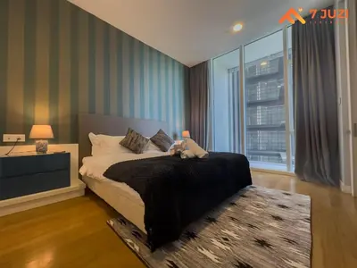 a bedroom with a bed and a large window at Sky Pool KLCC 2BR Platinum Suite C33 with Netflix in Kuala Lumpur