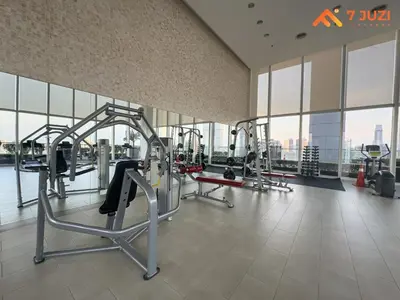 a gym with cardio equipment in a large building at Sky Pool KLCC 2BR Platinum Suite C33 with Netflix in Kuala Lumpur