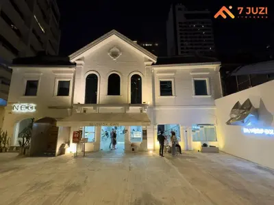 a white building with people standing outside of it at Sky Pool KLCC 2BR Platinum Suite C33 with Netflix in Kuala Lumpur