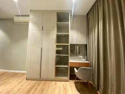 a closet with a desk and a chair in a room at Comfort Suites At Quill Residence in Kuala Lumpur