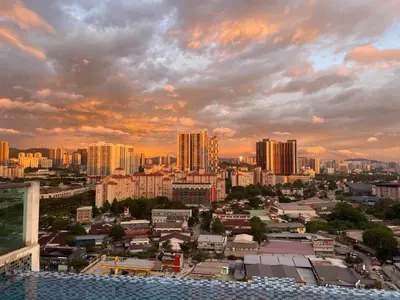 a view of a city at sunset with buildings at \u670d\u52a1\u5f0f\u516c\u5bd3 in Kuala Lumpur