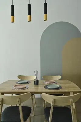 a dining room table with chairs and a table with plates at Jln Razak Mansion, in Kuala Lumpur