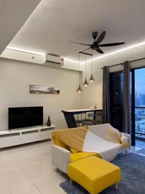 a bedroom with a bed and a flat screen tv at trion Klcc 2 bedroom apartment in Kuala Lumpur