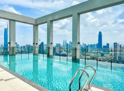 a swimming pool with a view of the city at trion Klcc 2 bedroom apartment in Kuala Lumpur