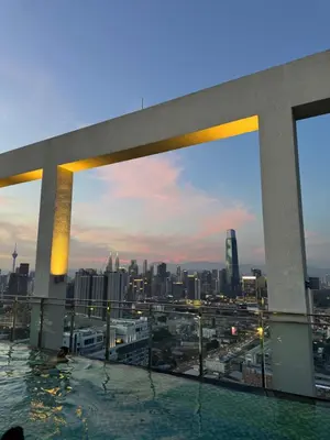 a rooftop swimming pool with a view of a city at trion Klcc 2 bedroom apartment in Kuala Lumpur