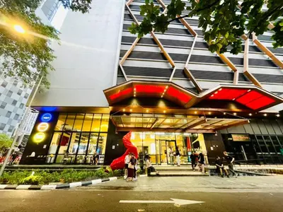 a group of people standing outside of a building at KLCC Scarletz Residence Near By KL in Kuala Lumpur