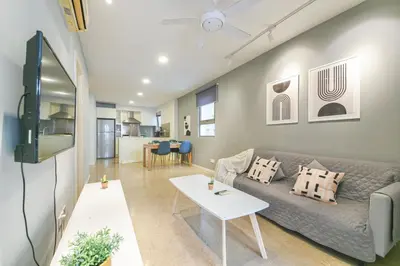 a living room with a couch and a table at Bintang Fairlane near Pavillion Bukit Bintang in Kuala Lumpur