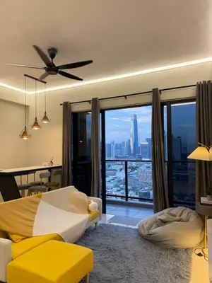 a bedroom with a yellow bed and a large window at klcc 2 bedroom trion in Kuala Lumpur
