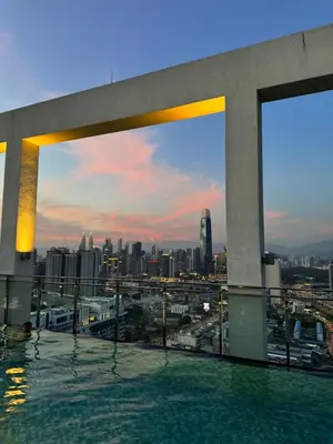 a rooftop swimming pool with a view of the city at klcc 2 bedroom trion in Kuala Lumpur