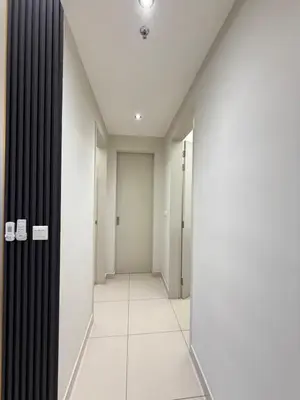 an empty hallway with black curtains and white tiles at klcc 2 bedroom trion in Kuala Lumpur