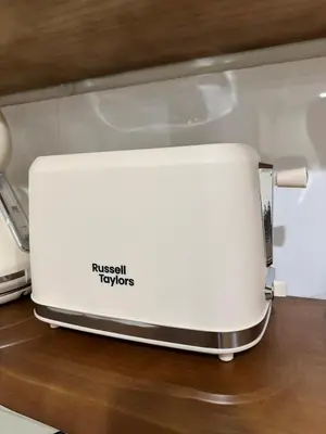 a white toaster sitting on top of a counter at The Little Bali - 6Room - 18Pax in Kuala Lumpur