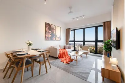 a living room with a table and a couch at Agile Bukit Bintang by Avery at KLCC#5 mins to Pavilion &TRX#Garden Pool#Free Parking#中英文房东 in Kuala Lumpur