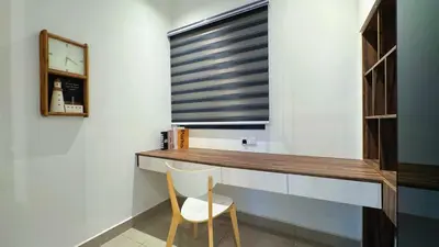 a desk in a room with a chair and a window at M Centura Sentul, Jalan Sentul Pasar, Sentul KL City in Kuala Lumpur